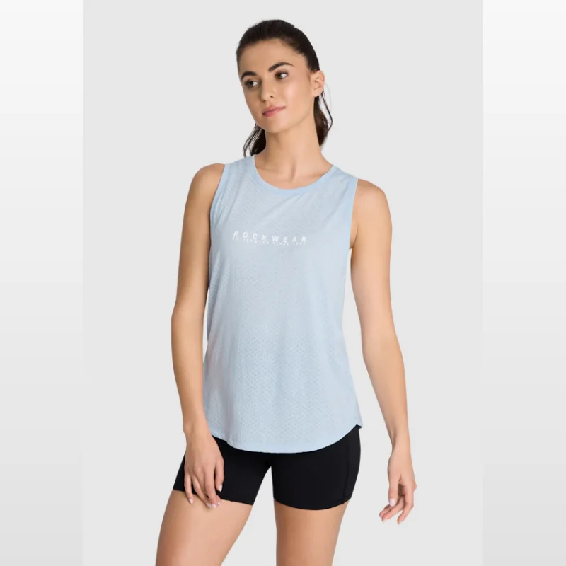 Woman wearing a light blue Rockwear Fleur mesh tank top and black shorts.