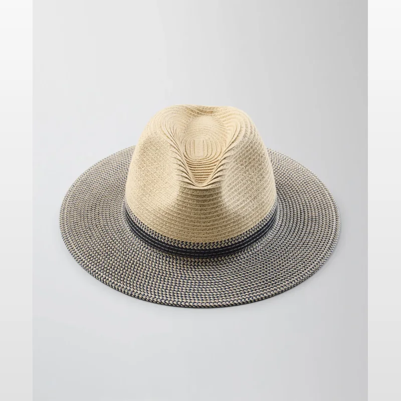 A light brown paper braid fedora hat with a navy and white woven band and brim, set against a white background.