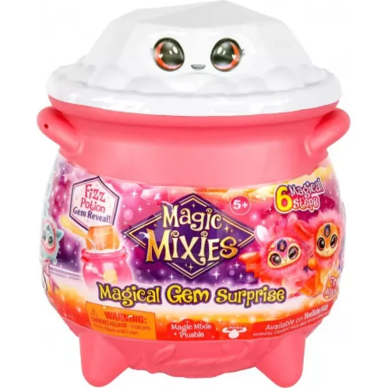 A pink Magic Mixies Magical Gem Surprise Cauldron with a white gem-shaped lid, featuring cartoon eyes and handles. The cauldron has colourful packaging showing magical elements and two fluffy creatures.