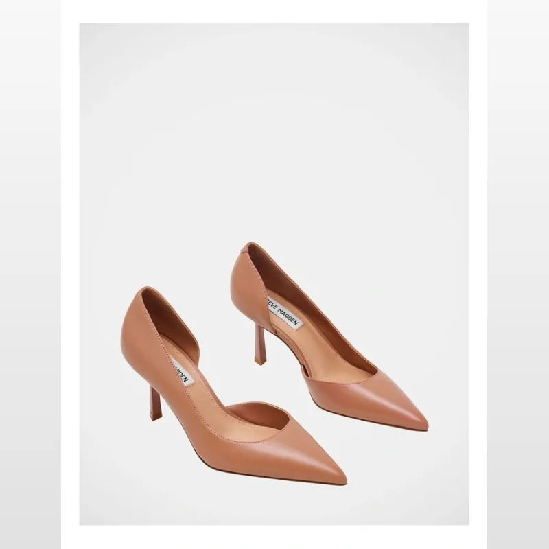 A pair of Steve Madden Vena dress heels in dark blush leather, featuring a pointed toe and a distinctive curved side cut-out.
