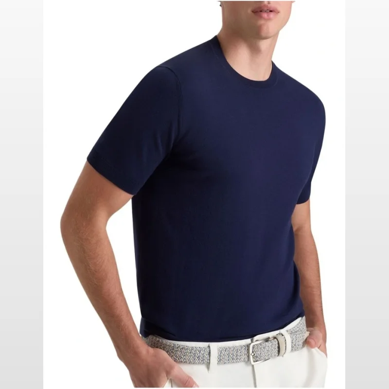 Man wearing a navy blue short-sleeved knit t-shirt with a crew neck.