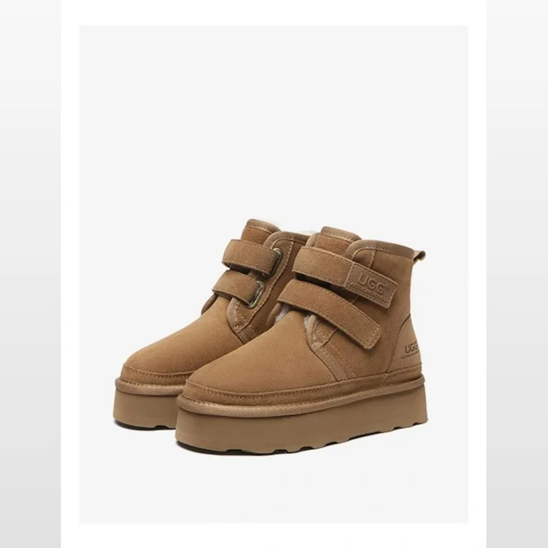 A pair of chestnut brown cow suede platform ugg boots with hook-and-loop straps and a thick EVA sole.