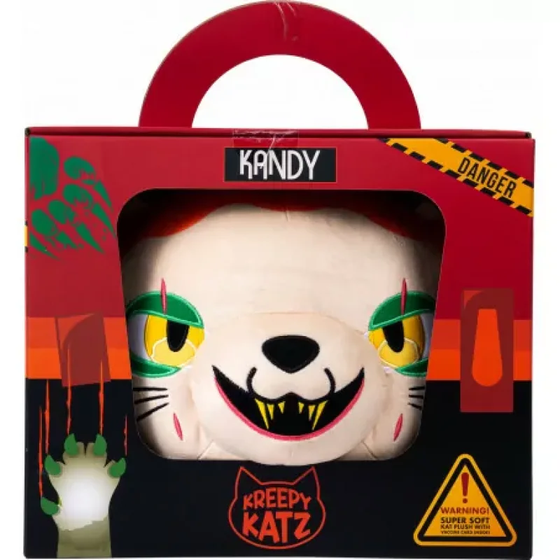 A Kreepy Katz Kandy Head plush toy with green eyes and sharp teeth, presented in a red and black branded cardboard carrier box with a handle.
