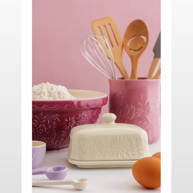 Cream stoneware butter dish with embossed floral pattern, part of the Mason Cash In the Meadow collection.