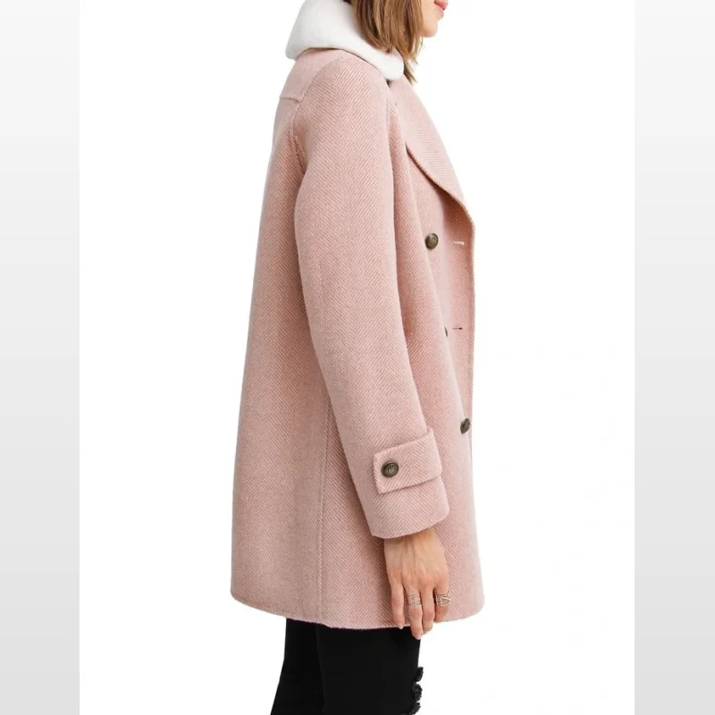 Side view of a woman wearing a blush pink wool blend coat with a herringbone pattern and a removable white sherpa collar.