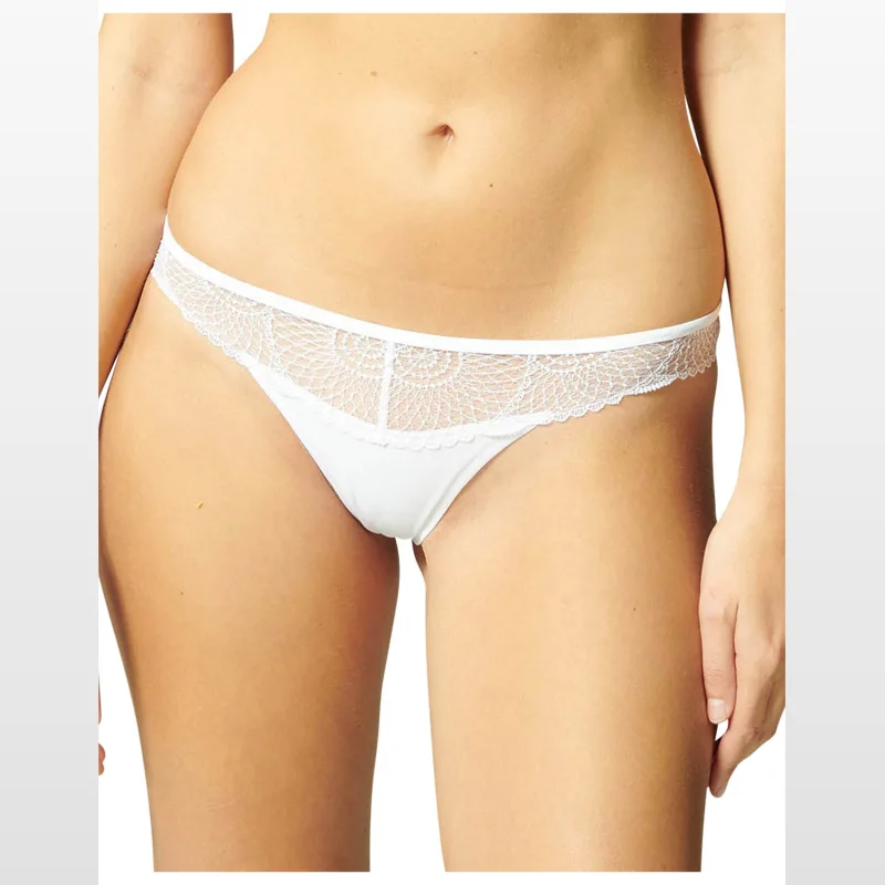 Close-up of a woman wearing a white Simone Perele Reflet Bikini Brief with lace trim.