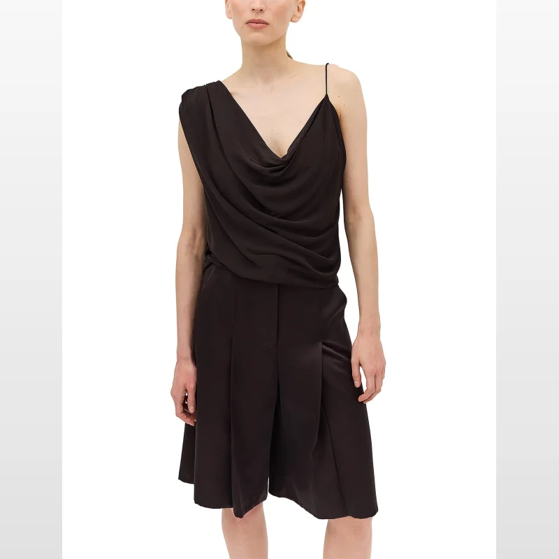 Woman wearing a chocolate brown sleeveless Bianca Spender top with a draped cowl neckline and a thin spaghetti strap on one shoulder.
