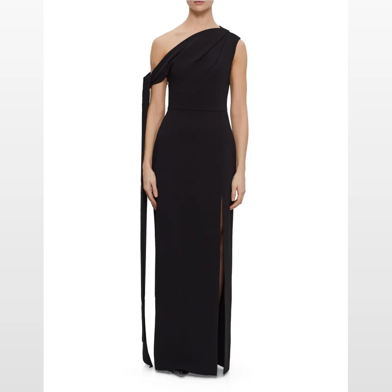 Black one-shoulder maxi dress with a high slit and draped detailing on the shoulder.