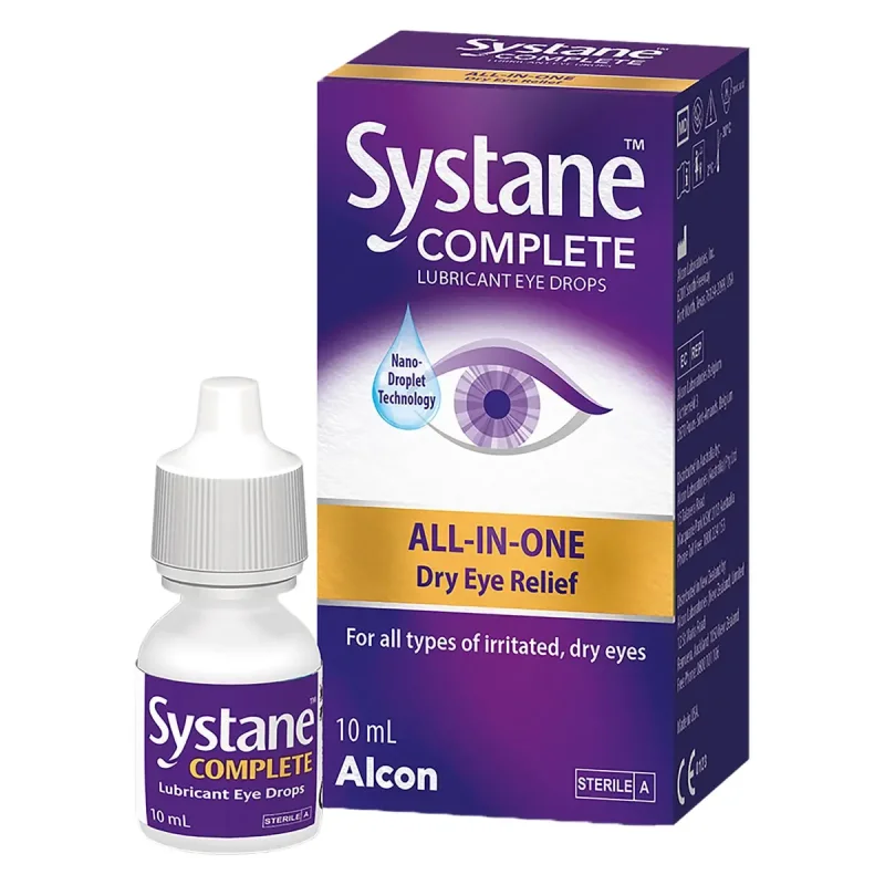 Systane Complete Lubricant Eye Drops 10ml bottle and box packaging, featuring purple and yellow branding with an eye graphic and text indicating 'All-in-One Dry Eye Relief'.