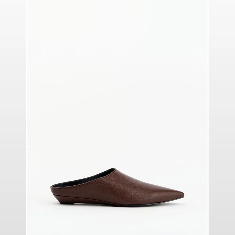 Brown leather pointed toe slide on mules from Alias Mae, displayed on a white background.