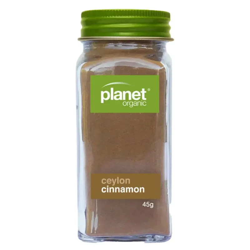A glass jar of Planet Organic Ceylon Cinnamon powder with a green lid, showing the brand logo and 'ceylon cinnamon 45g' on the label.
