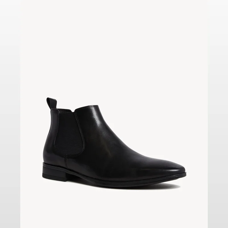 A black leather Giovanni dress boot with an almond toe and elasticated side panels, presented on a white background.