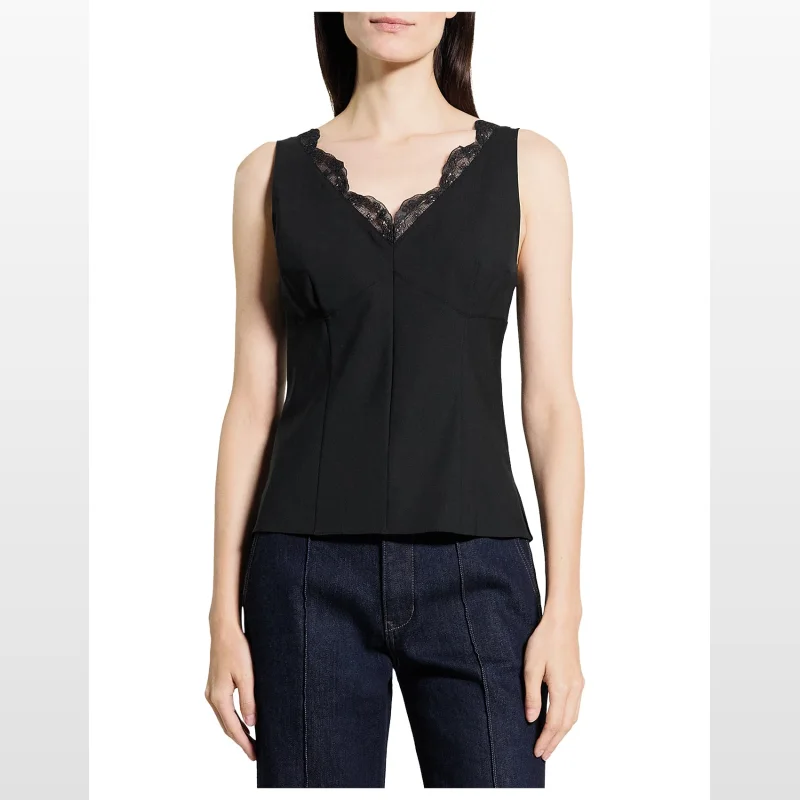 Woman wearing a black sleeveless Theory Lace Tailor Top with lace detailing on the neckline.