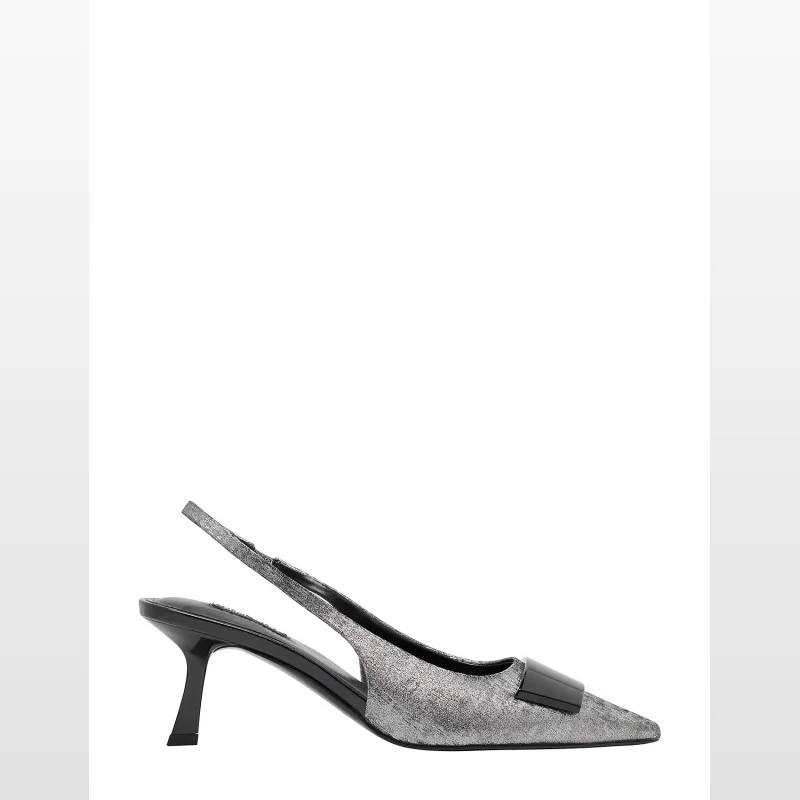 Side view of a silver Nine West Adena Slingback Pump with a pointed toe, mid-height heel, adjustable slingback strap, and a black buckle detail across the toe.