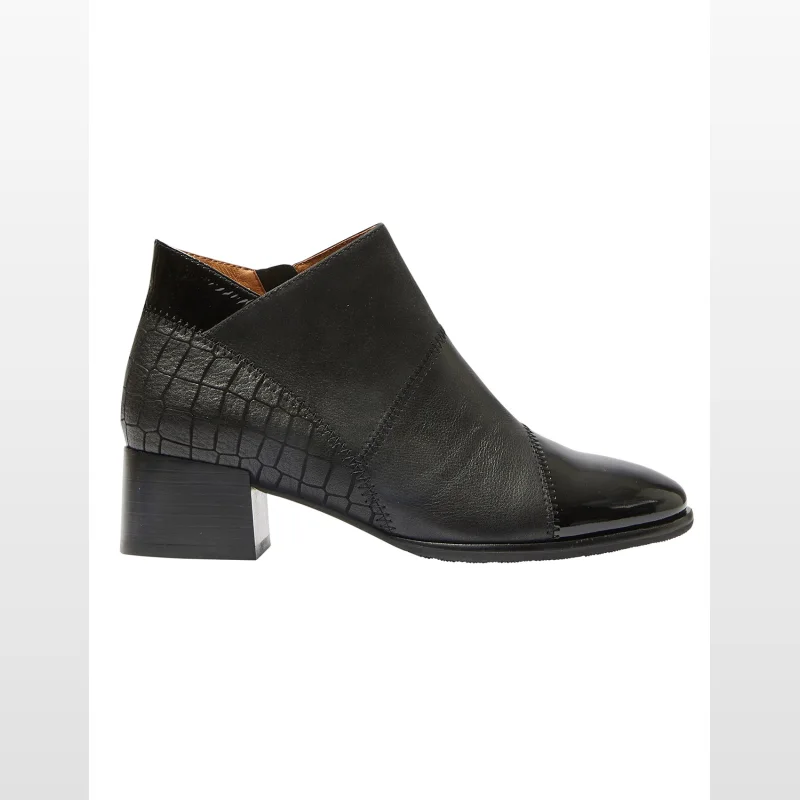 Black leather ankle boot with a block heel, pointed toe, and textured heel counter.