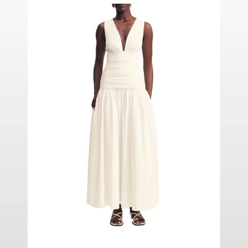 Woman wearing a sleeveless ivory Shona Joy Campbell Gathered Maxi Dress with a plunging neckline and gathered detailing.