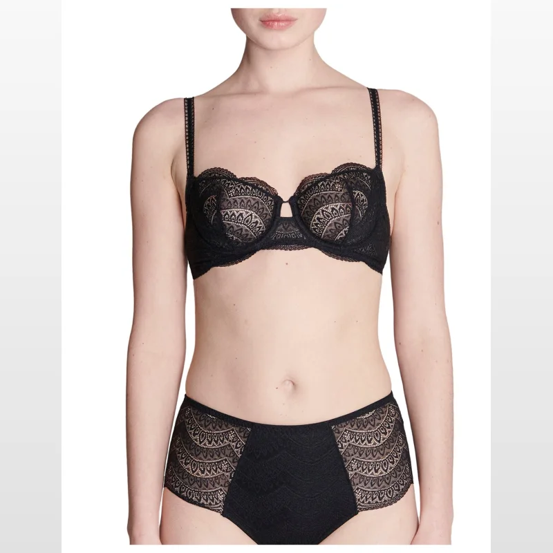 Black Simone Perele Karma Half Cup Bra with intricate lace detailing and adjustable straps, worn by a model.