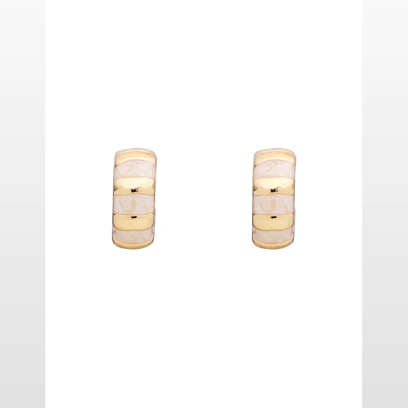 A pair of mini hoop earrings with gold-coloured plating and white enamel bands, featuring a swirled pattern within the enamel.