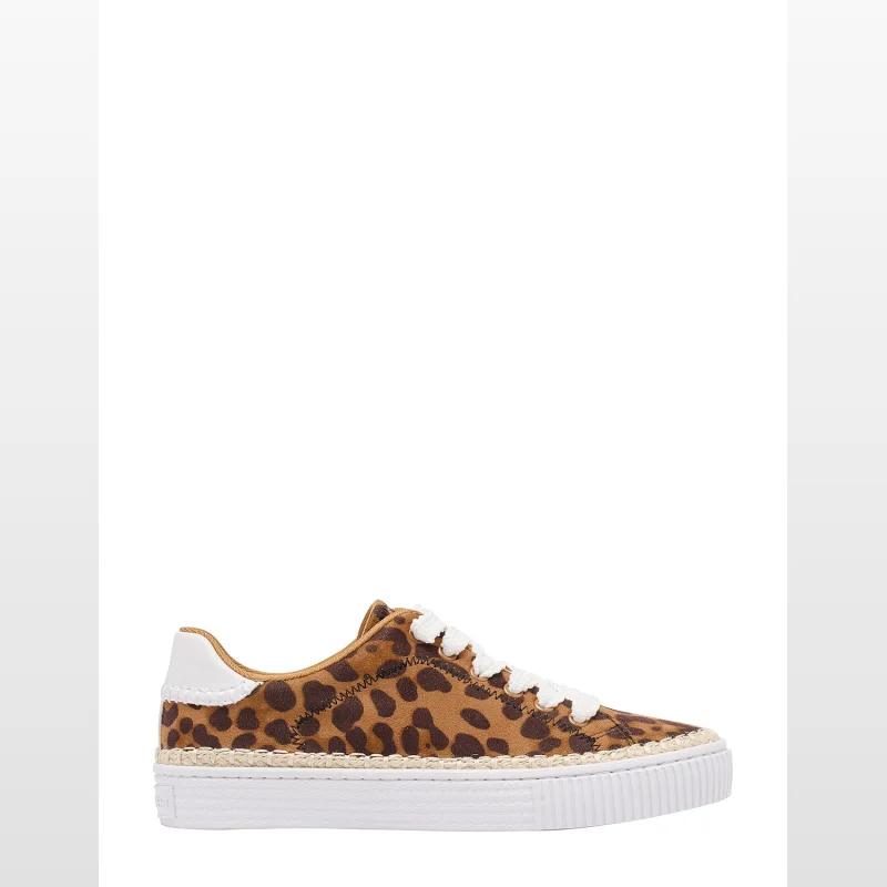 Side view of a Nine West Singy sneaker with a leopard print design, white laces, and a white platform sole with espadrille detailing.