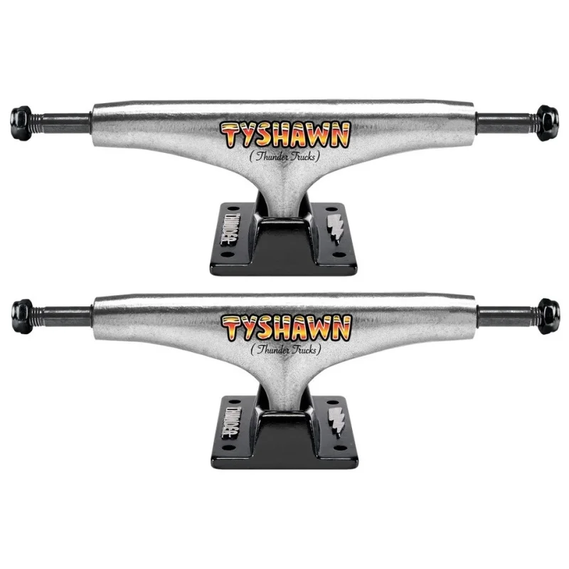 Two silver Thunder Hollow Lights Tyshawn skateboard trucks with black baseplates and colourful 'TYSHAWN' branding.