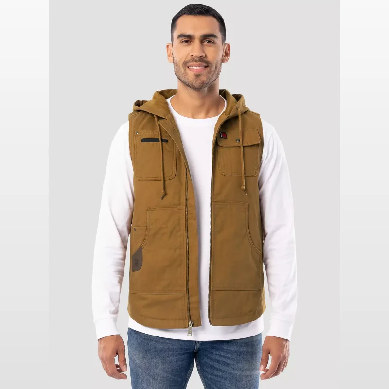 Man wearing a brown hooded work vest by Wrangler RIGGS WORKWEAR over a white long-sleeved shirt and blue jeans.