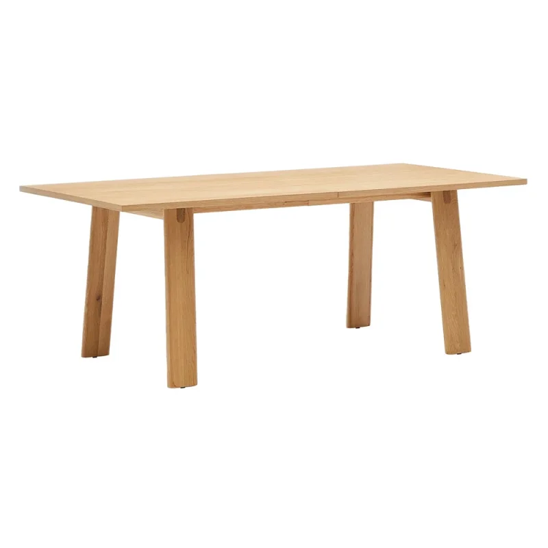 A light-coloured wooden extendable dining table with four straight legs, shown from a front-side angle against a white background.