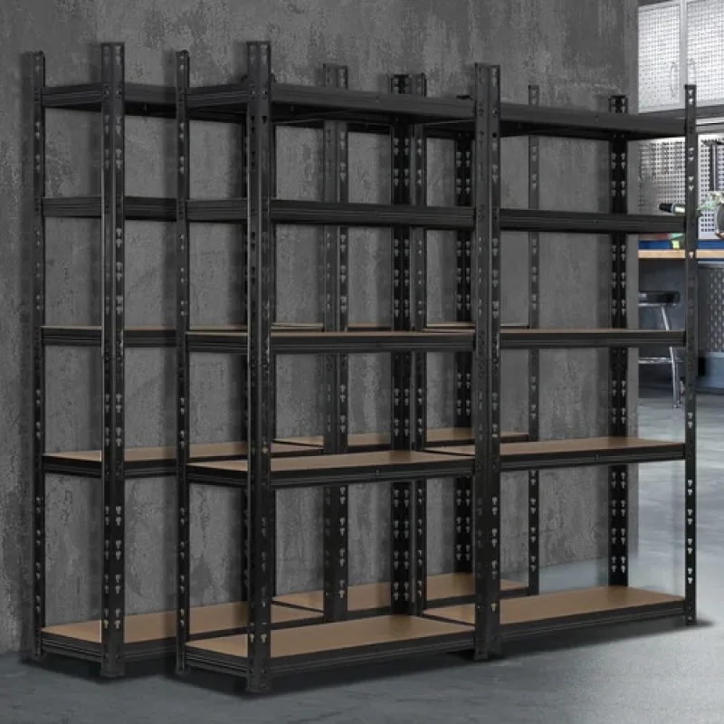 Set of four black Jemison steel shelving units with wooden shelves against a concrete wall.