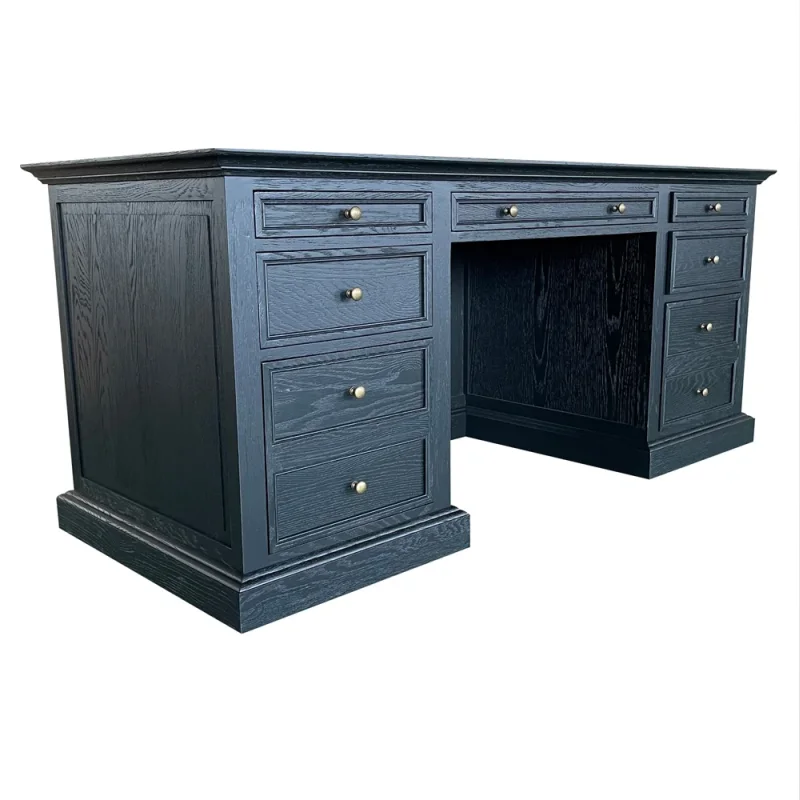 A black oak wood executive desk with seven drawers and brass hardware, featuring a classic design with a spacious work surface.