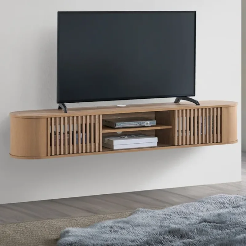 A light oak wood wall-mounted TV unit with slatted doors and open shelving, featuring a television on top.