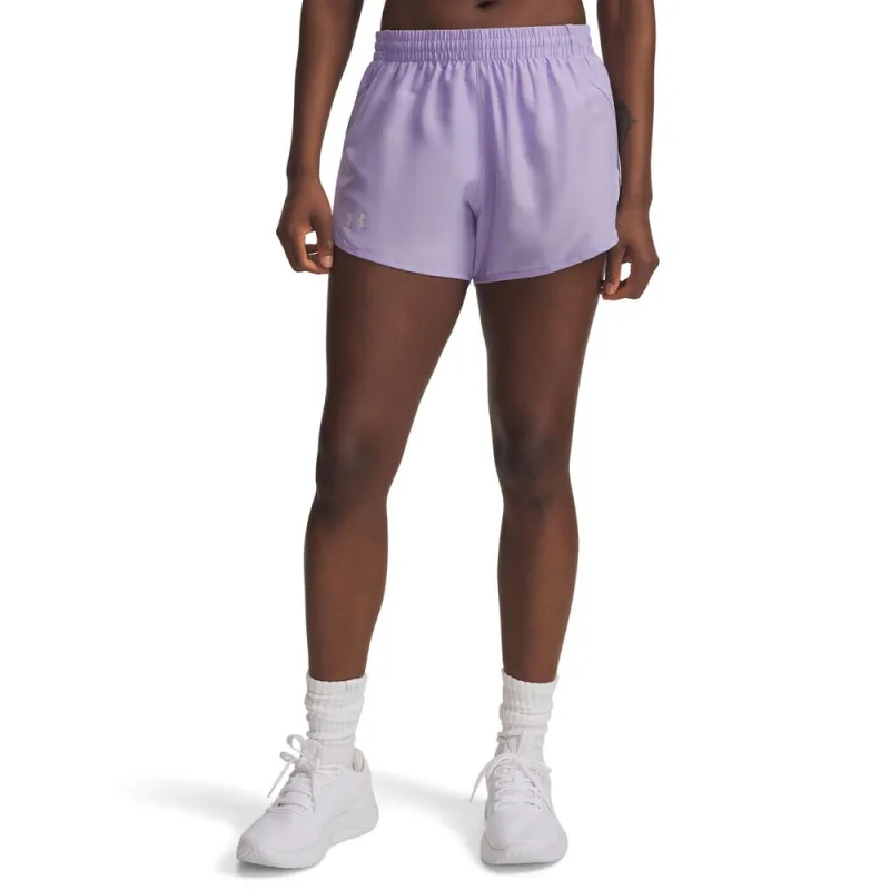 Woman wearing light purple Under Armour Fly By 3 inch running shorts with a ruched waistband and a silver Under Armour logo on the left leg.