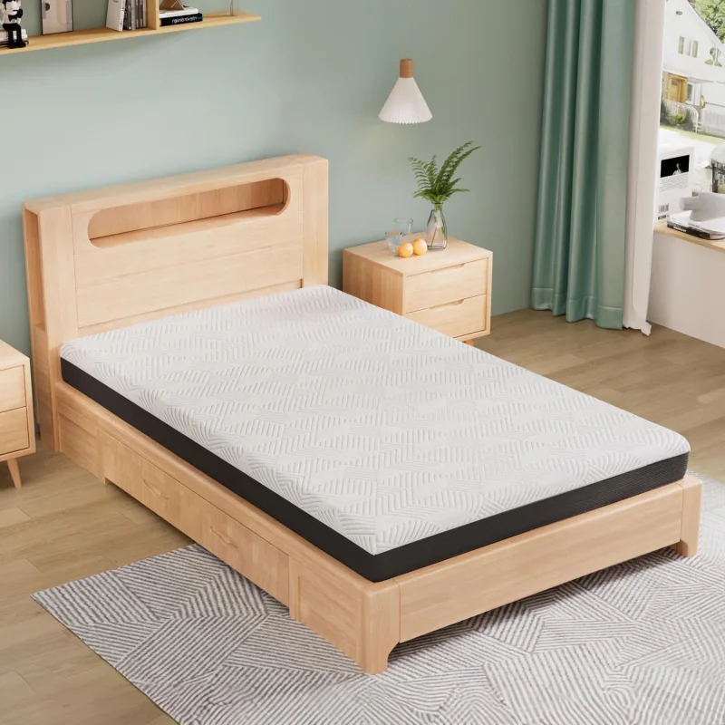 A 15cm Taya Gel Memory Foam Mattress with a white patterned cover is placed on a light wood bed frame with storage drawers.