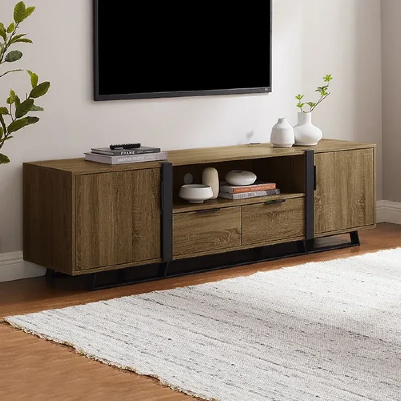 A modern, wood-grain finish TV unit with two doors, two drawers, and an open shelf, set against a wall with a TV above and a rug in front.