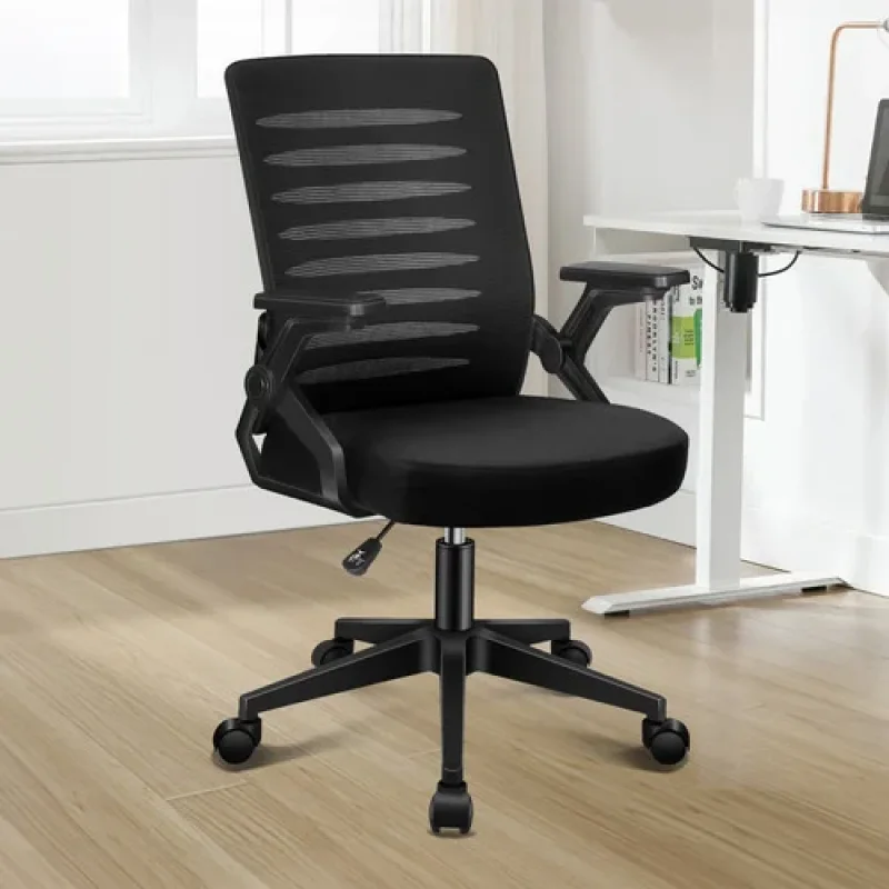 Black Hughes Office Chair with a mesh back and padded seat, featuring adjustable armrests and a five-star base with wheels, shown in a home office setting.