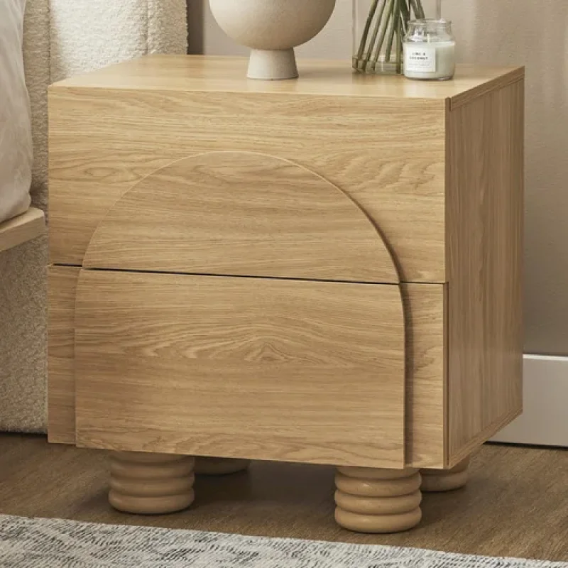 A light oak veneer bedside table with two drawers and distinctive rounded legs, featuring a curved design element on the top drawer.