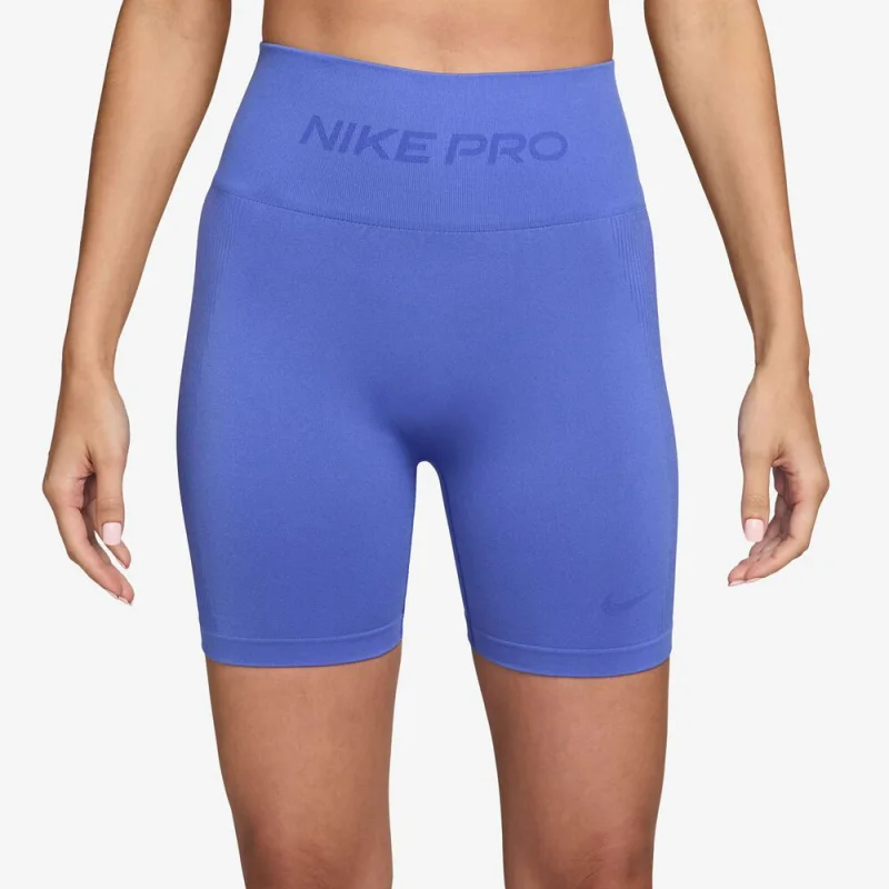 Close-up of a woman wearing Nike Pro seamless blue short tights with a high waistband and Dri-FIT technology.