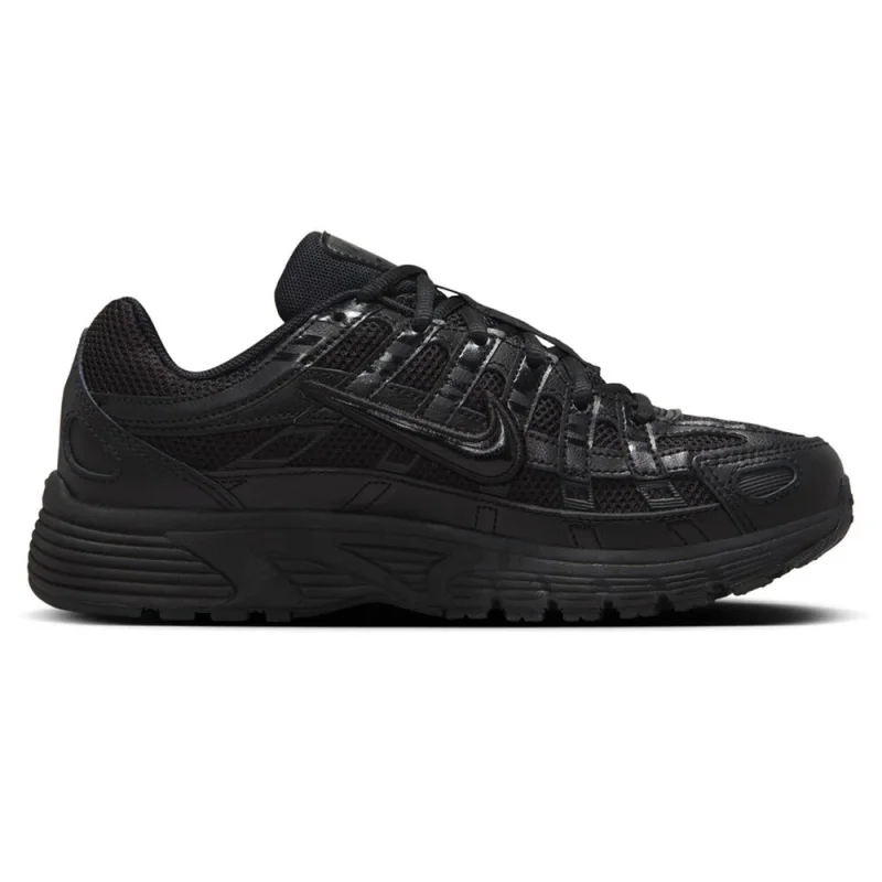 Side view of a black Nike P-6000 GS kids casual shoe, featuring mesh and synthetic overlays, a moulded Swoosh, and a waffle traction outsole.