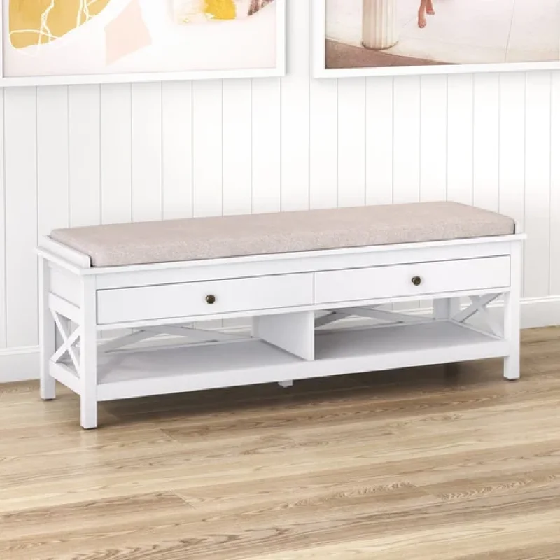 A white Noosa 2 drawer shoe storage ottoman bench with a beige upholstered seat, featuring two drawers and an open shelf below, set against a white paneled wall.