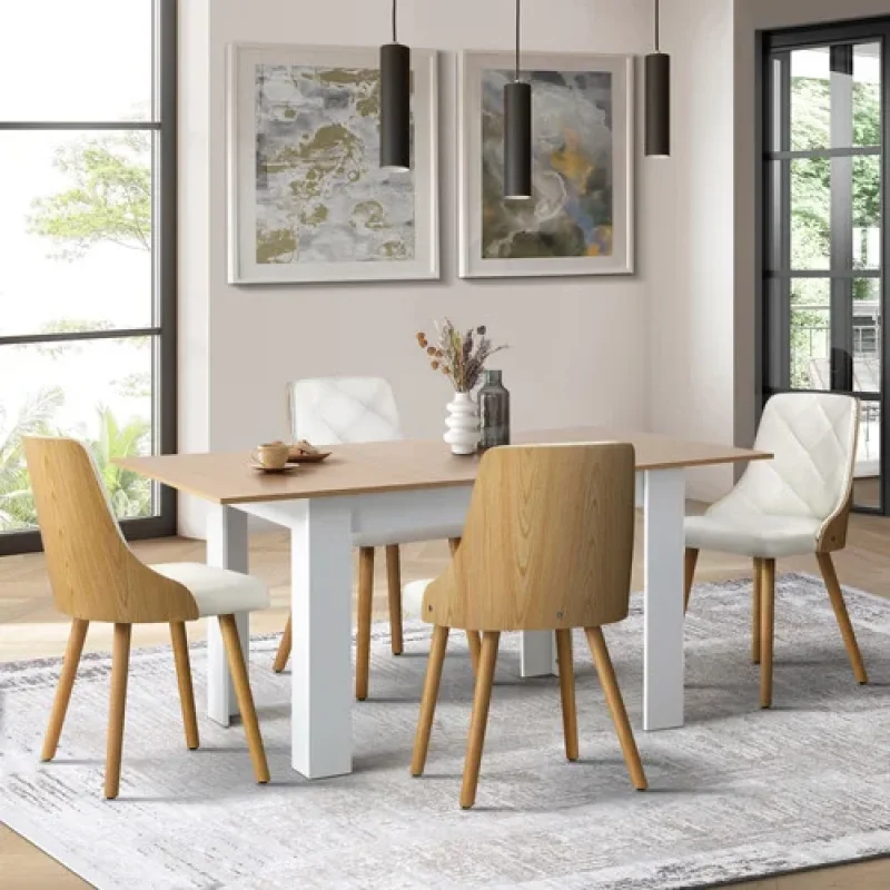 A Laina extendable dining table with a light wood top and white base, surrounded by four light wood and white upholstered dining chairs, set in a modern dining room.