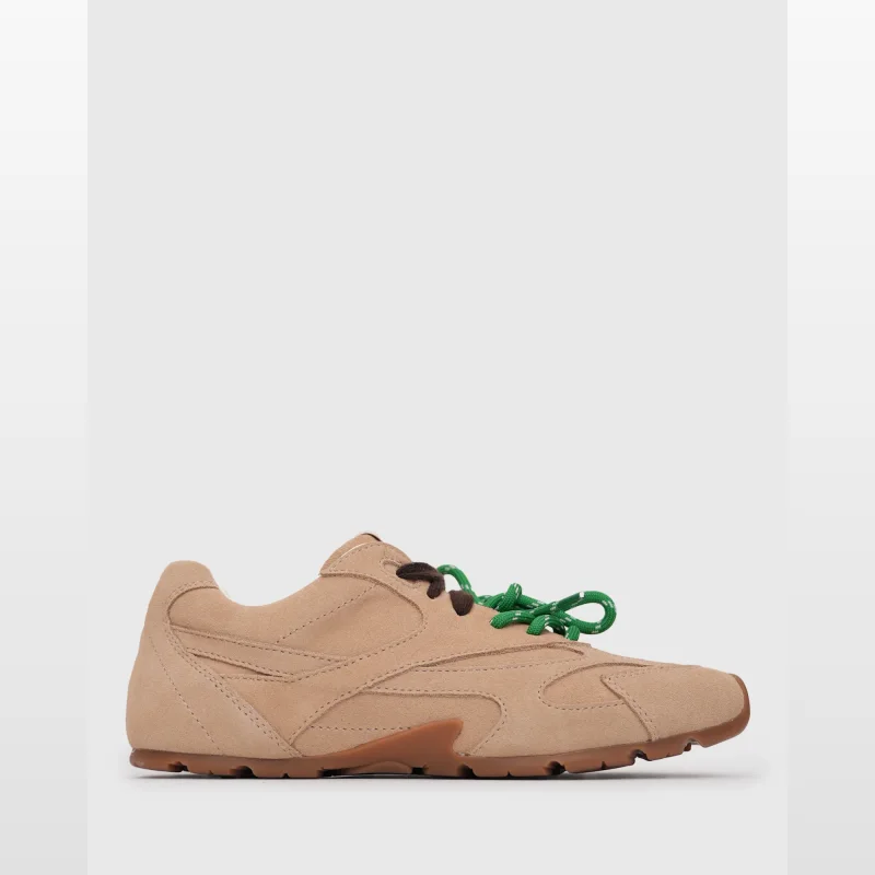 A single tan suede leather AXTON sneaker with green laces and brown accents, shown from the side against a white background.