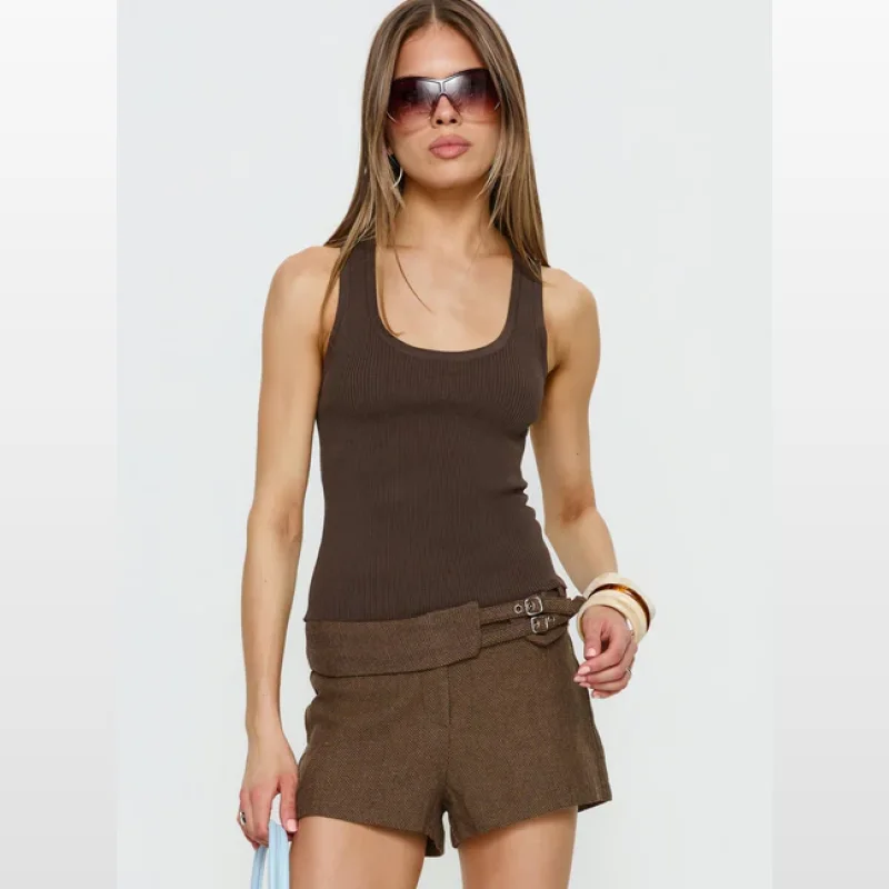 Woman wearing a chocolate brown ribbed longline tank top with a scoop neckline and fixed straps.