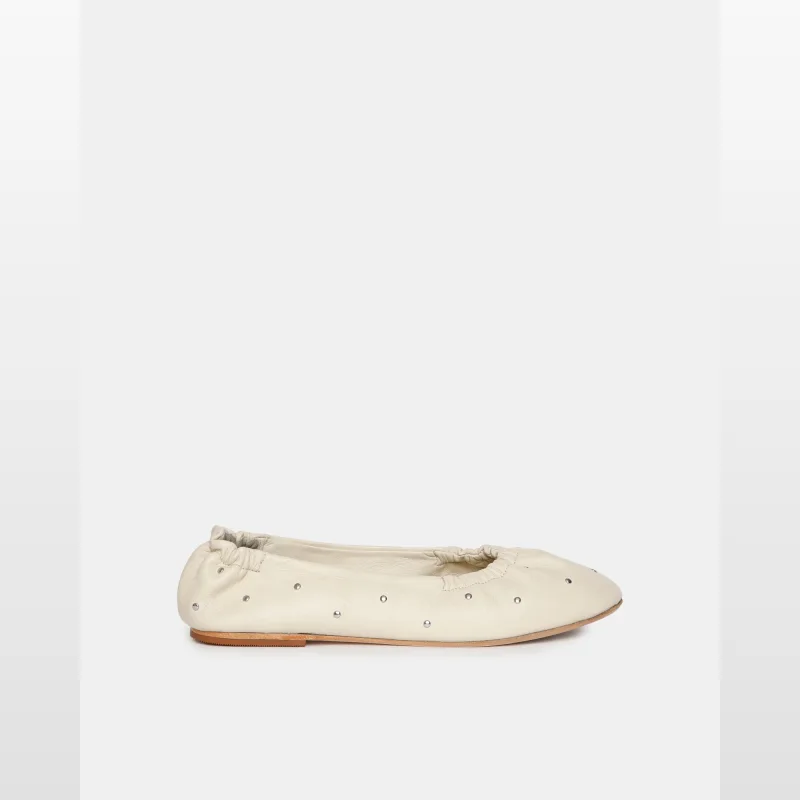 A single Sol-sana Montagine ballet flat in off-white leather, adorned with small silver stud detailing. The shoe features a gathered elasticated topline and a rounded toe.