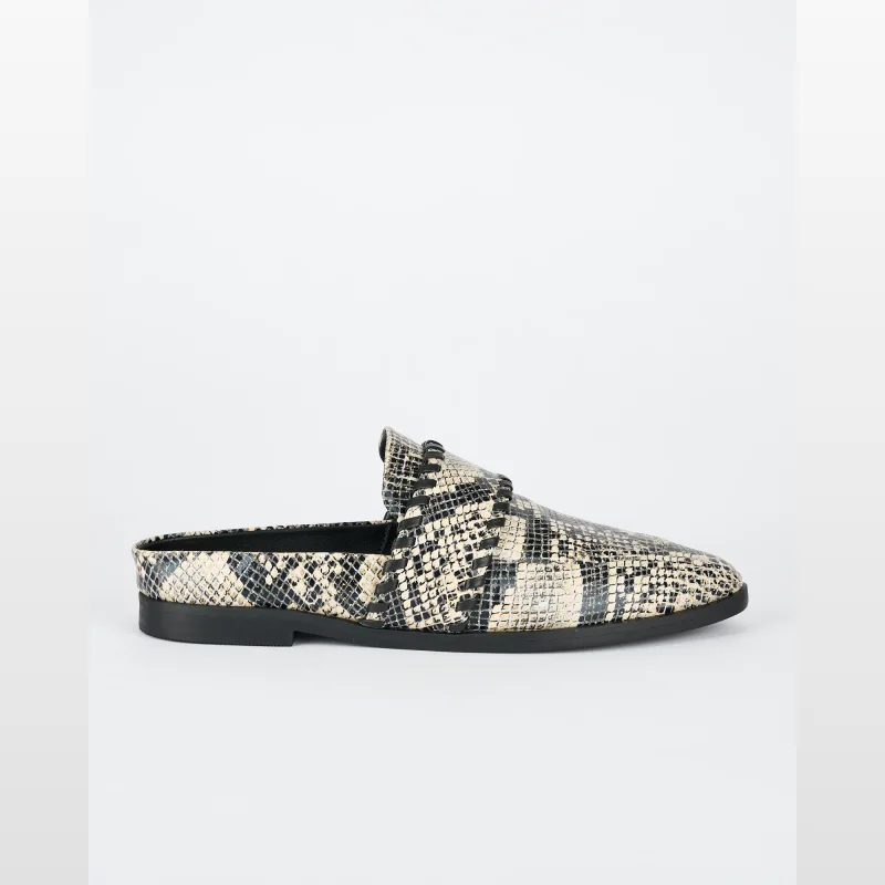 A single Sol-sana Crosby Slide shoe with a python print leather upper and black trim, shown from the side against a white background.