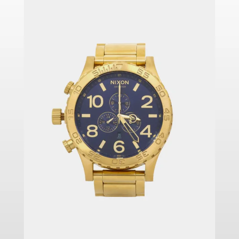 Gold Nixon 51-30 Chrono watch with a blue dial and gold stainless steel band.