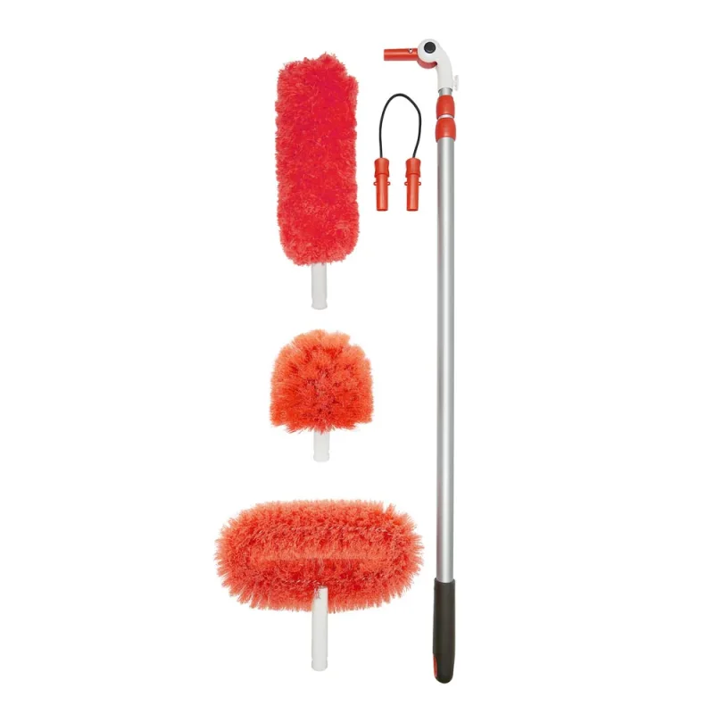 OXO Long Reach Dusting System with an extendable pole and three interchangeable red dusting heads: a fluffy microfiber head, a spherical cobweb duster, and a flat fan duster.