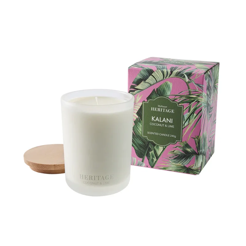 MyHouse Heritage Kalani Scented Candle in a frosted glass jar with a wooden lid, next to its tropical leaf-patterned box. The scent is Coconut & Lime.