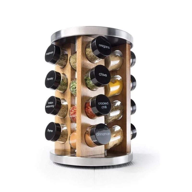 A Baccarat Spice Market Khari 16-jar rotating spice rack made of stainless steel and bamboo, filled with various labelled spices.