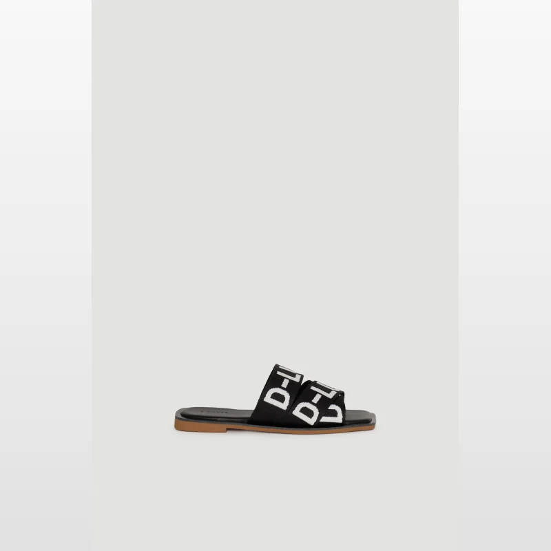 Black Decjuba D-Luxe Kia Tape Slide sandals with white D-Luxe logo on the webbed upper and a squared open toe.