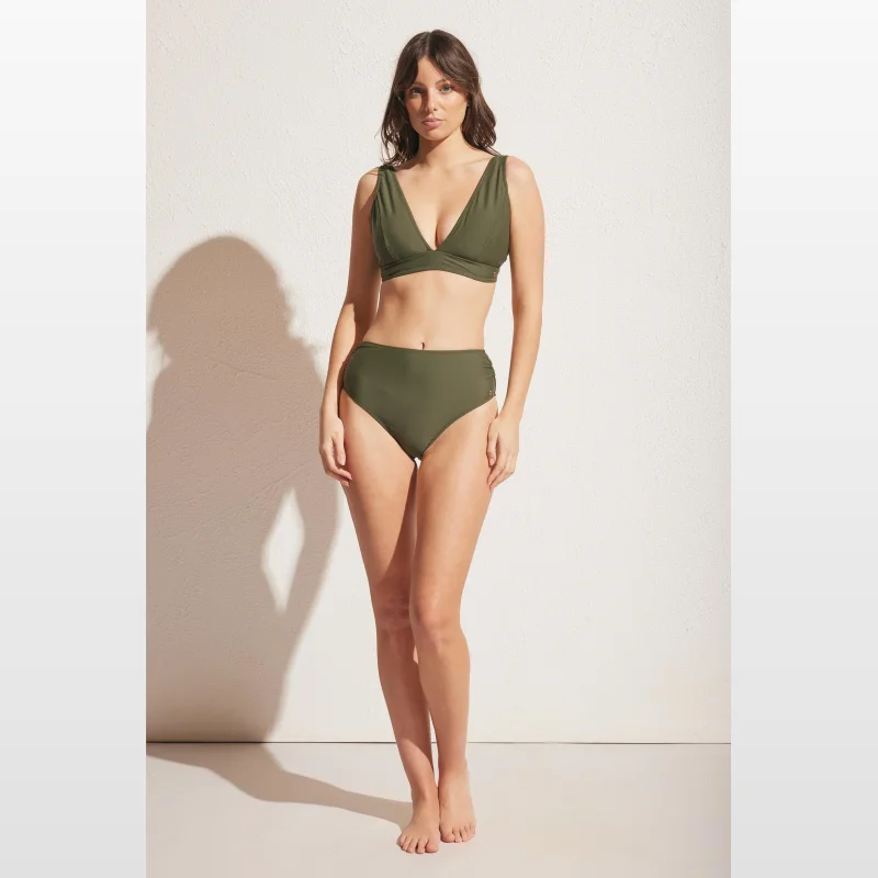 Woman wearing Decjuba Matte Gathered Bikini Bottom in olive green