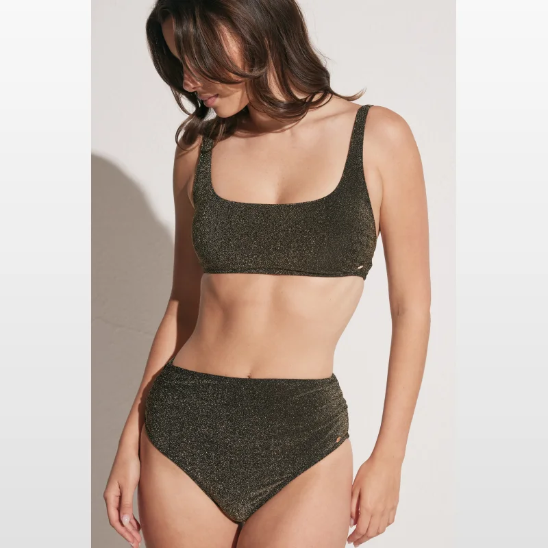 Woman wearing a shimmering dark gold square neck bikini top with adjustable straps and gold hardware detail.
