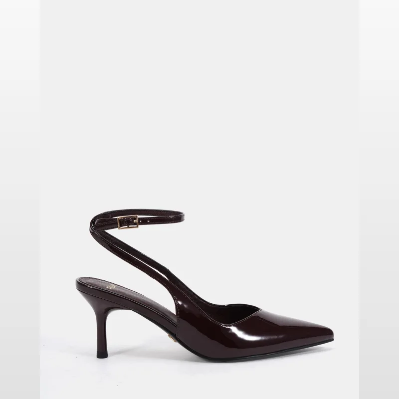 A close-up side view of a dark brown patent leather slingback pump with a pointed toe and a thin ankle strap with a gold buckle.